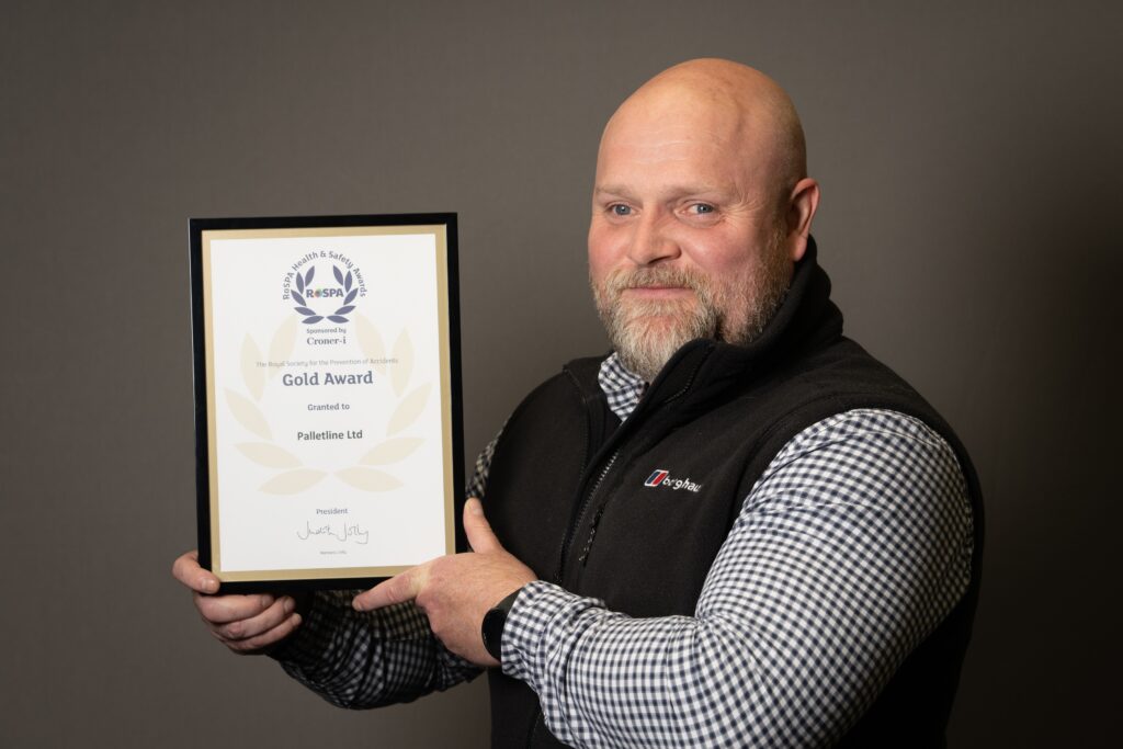 11th rospa gold for palletline health safety manager ken bell proudly shows off certificate - Health and Safety culture earns Palletline 11th RoSPA Award